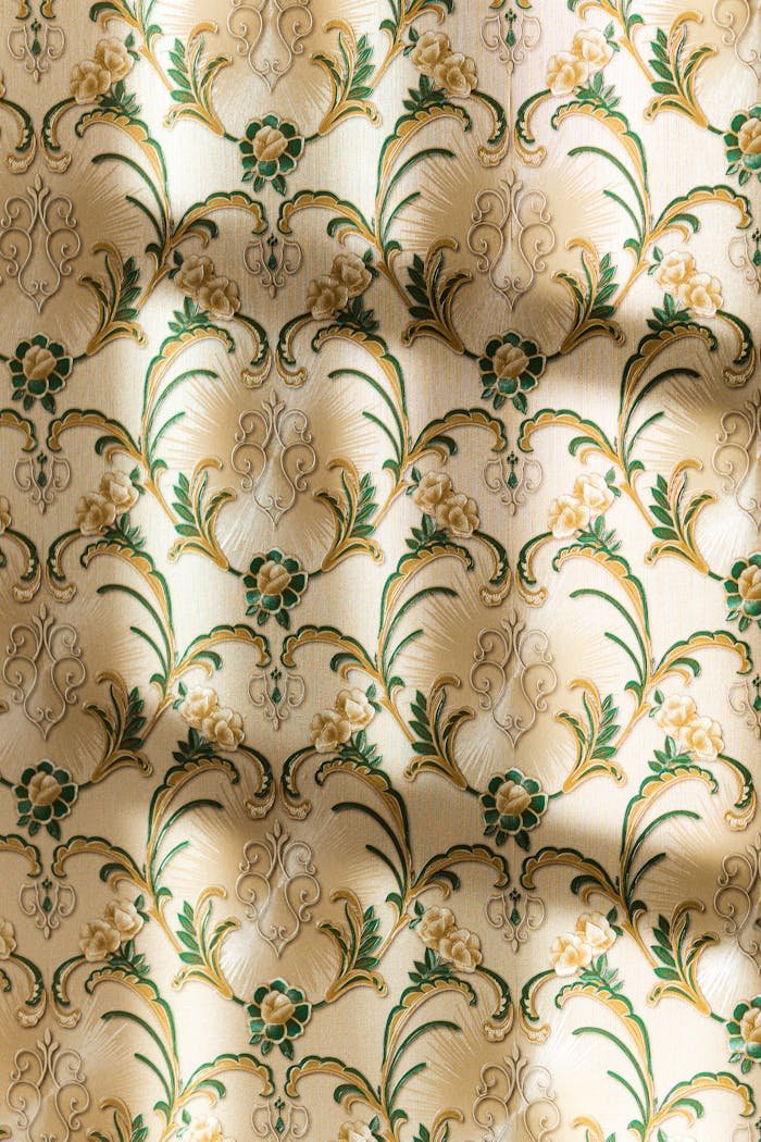 services-02 A vintage floral patterned wallpaper featuring elegant shadows, creating a classic aesthetic.